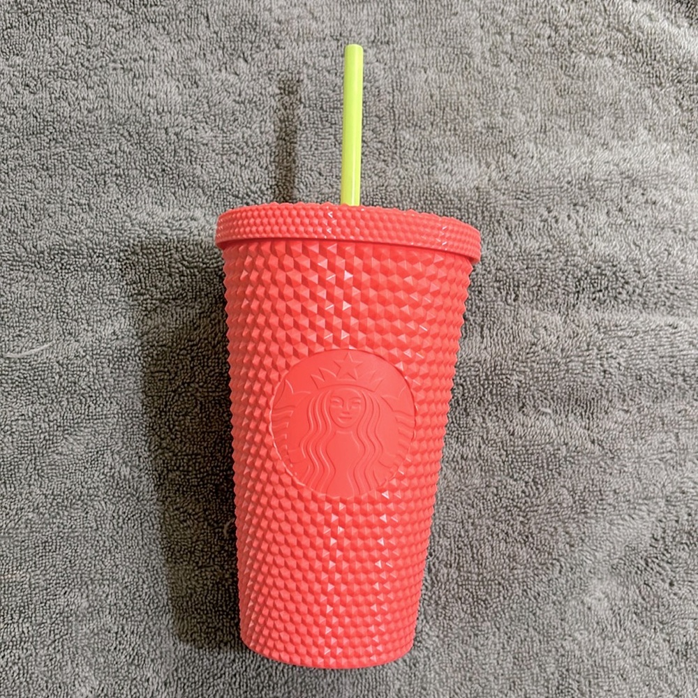 Pink and yellow Starbucks cup
